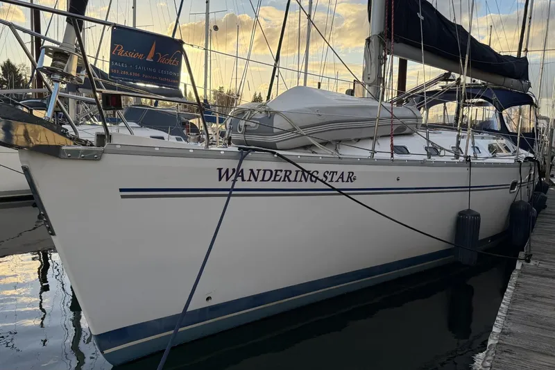 Slide: The Image of Catalina 470 sailboat named "Wandering Star" docked at marina, 2004 model. - 53