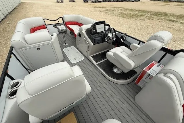 Slide: The Image of 2025 SunCatcher ELITE 324RC pontoon boat interior with plush seating and modern helm. - 10