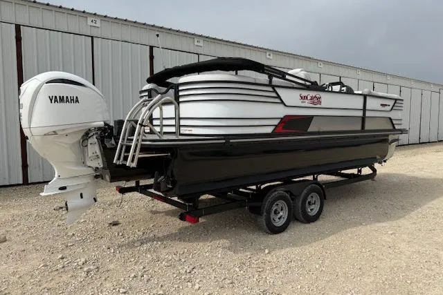 Slide: The Image of 2025 SunCatcher ELITE 324RC pontoon boat with Yamaha engine on trailer. - 4
