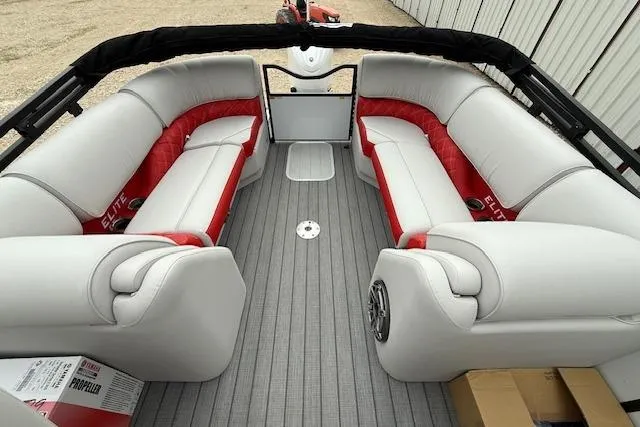 Slide: The Image of Luxurious interior of 2025 SunCatcher ELITE 324RC pontoon boat with red and gray seating. - 7