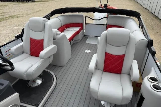 Slide: The Image of 2025 SunCatcher ELITE 324RC boat interior with gray and red seating, spacious layout. - 8
