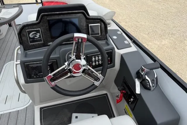 Slide: The Image of Steering console of 2025 SunCatcher ELITE 324RC boat with modern controls and dashboard. - 9