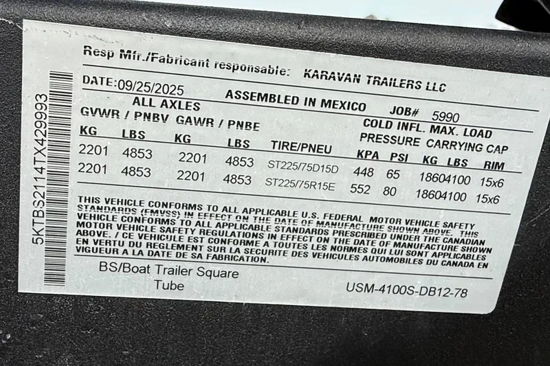 Slide: The Image of Label on a Karavan trailer, detailing specifications and compliance information. - 13