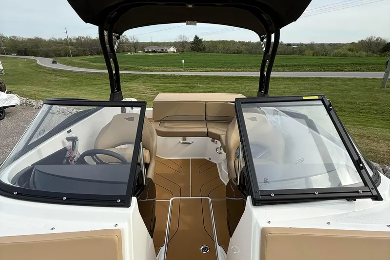 Slide: The Image of 2026 Bayliner V20i boat interior with tan seating and sleek design. - 9