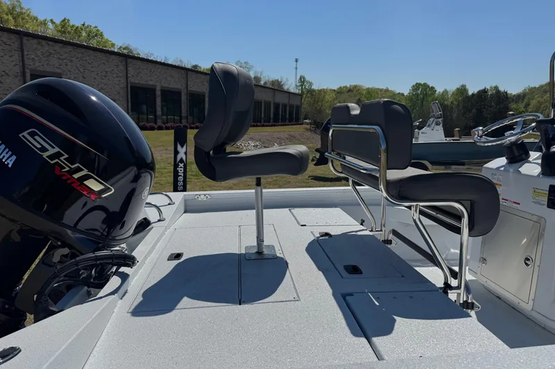 Slide: The Image of 2026 Xpress H20B Bay boat with Yamaha engine, featuring sleek seating and modern design. - 11