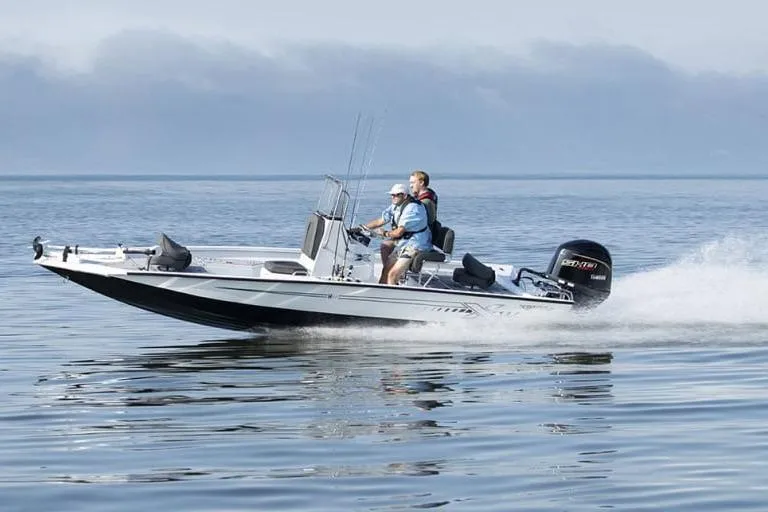 Slide: The Image of Manufacturer Provided Image: 2026 Xpress H20B Bay boat cruising on calm water with two passengers. - 15