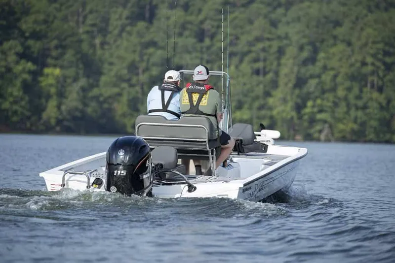 Slide: The Image of Manufacturer Provided Image: 2026 Xpress H20B Bay boat cruising on a lake with two passengers. - 17