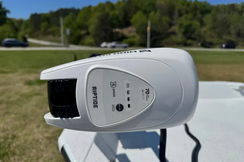 Slide: The Image of Minn Kota Riptide motor on 2026 Xpress H20B Bay boat, outdoors. - 2