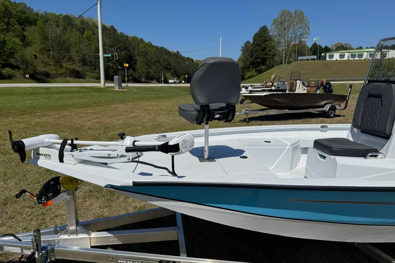 Slide: The Image of 2026 Xpress H20B Bay boat with Minn Kota trolling motor on trailer. - 3