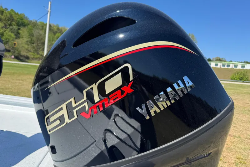 Slide: The Image of Yamaha SHO VMAX engine on 2026 Xpress H20B Bay boat, outdoors in sunny setting. - 9
