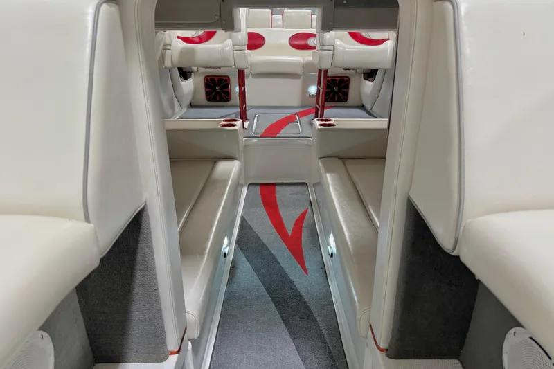 Slide: The Image of Interior of 2004 Sleekcraft Enforcer 30 boat with white and red seating. - 11