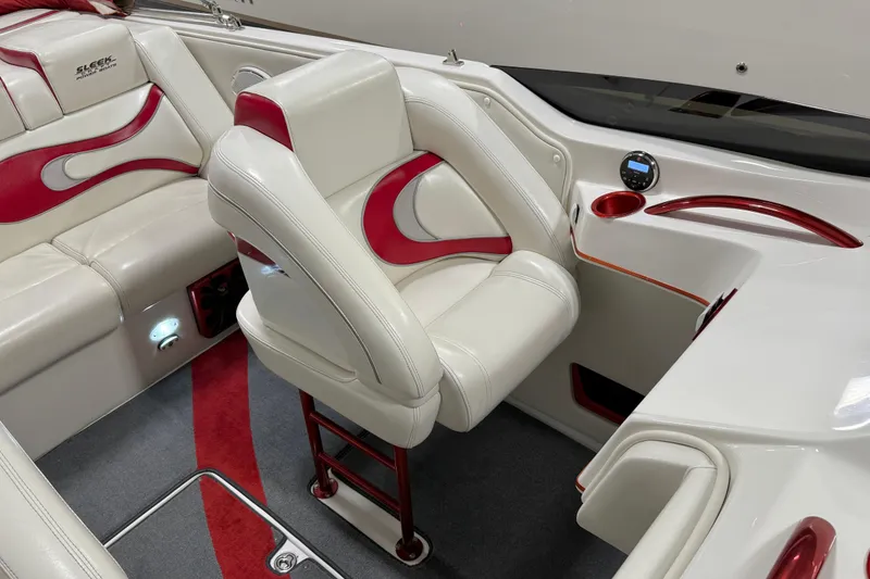 Slide: The Image of Interior of 2004 Sleekcraft Enforcer 30 boat with white and red seating. - 15