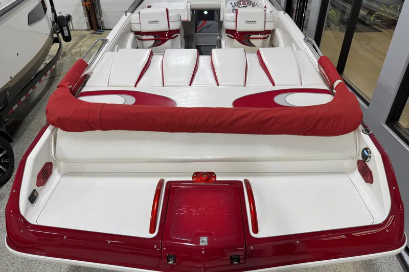 Slide: The Image of Interior of a 2004 Sleekcraft Enforcer 30 boat with stylish red and white seating. - 19