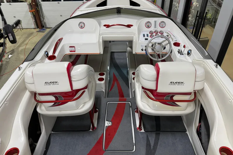 Slide: The Image of Interior of a 2004 Sleekcraft Enforcer 30 powerboat with white and red seating. - 20