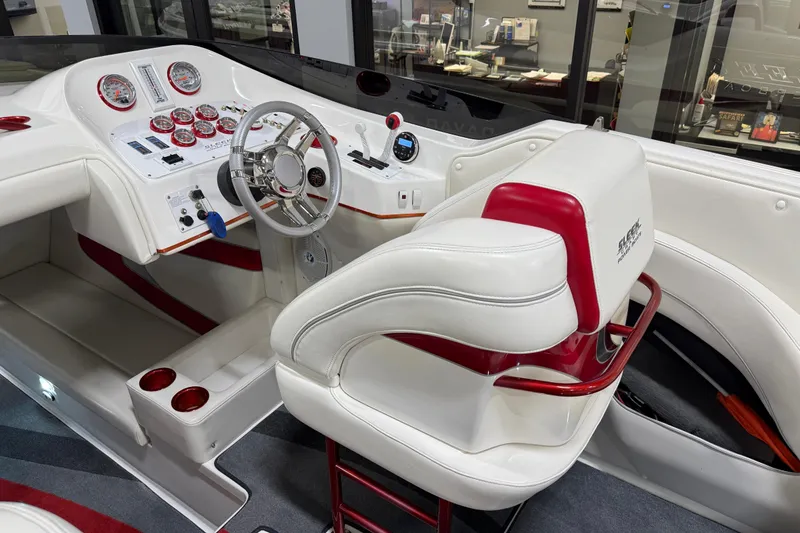 Slide: The Image of Interior of a 2004 Sleekcraft Enforcer 30 powerboat with white and red seating. - 23