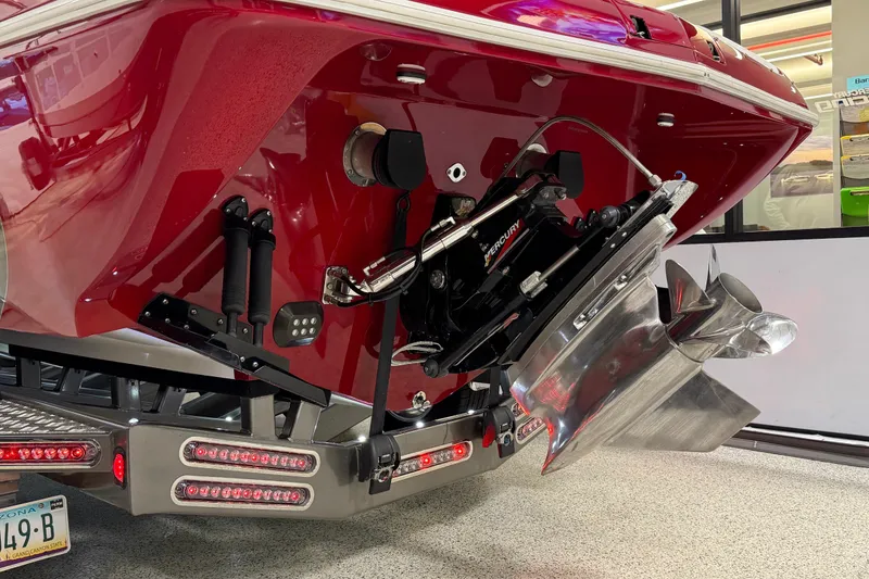 Slide: The Image of Rear view of a 2004 Sleekcraft Enforcer 30 boat with Mercury outboard motor. - 4