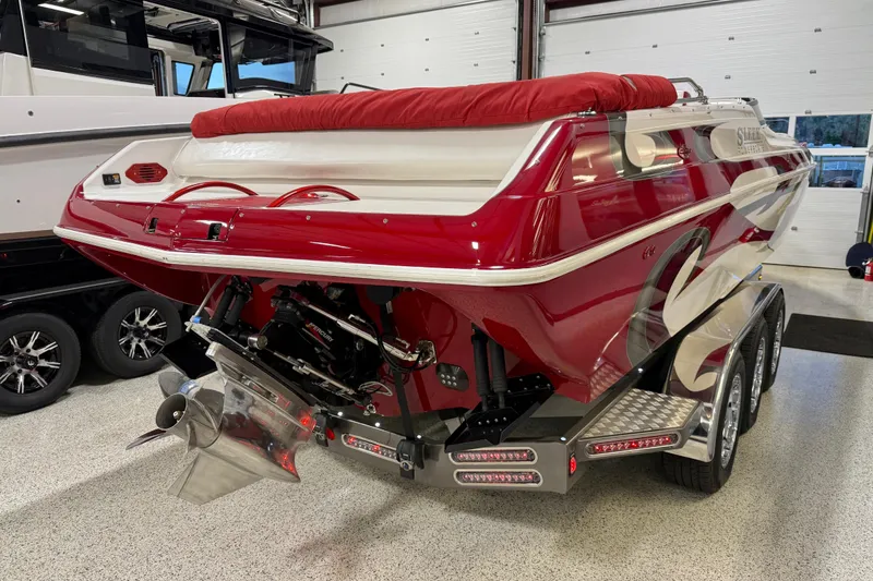 Slide: The Image of Red 2004 Sleekcraft Enforcer 30 boat hull with trailer. - 6