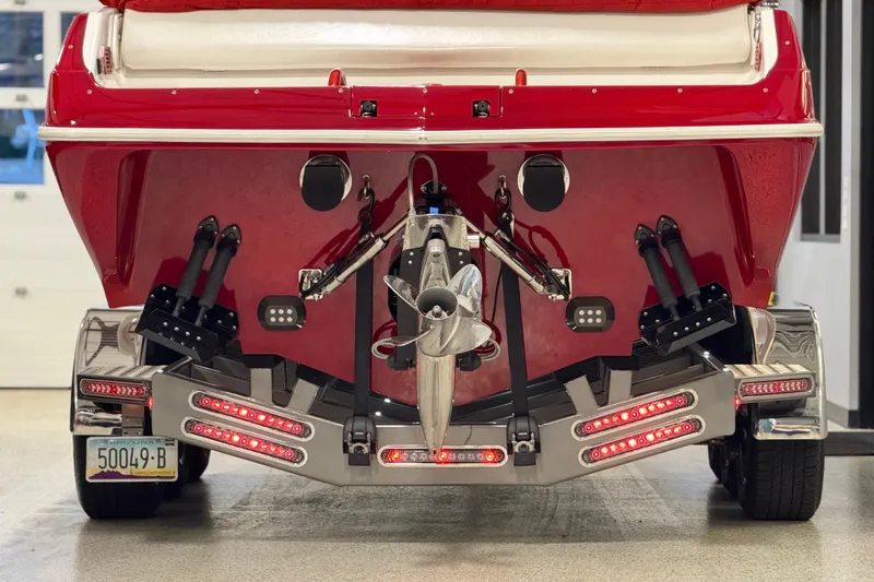 Slide: The Image of Rear view of a 2004 Sleekcraft Enforcer 30 boat with trailer and propeller. - 7