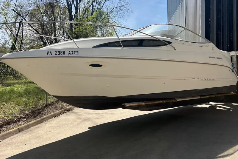 The Image of 2001 Bayliner 2655 Ciera boat on trailer, parked outdoors. - 0