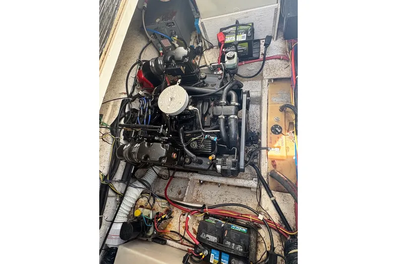 Slide: The Image of Engine compartment of a 2001 Bayliner 2655 Ciera boat, showcasing wiring and components. - 15
