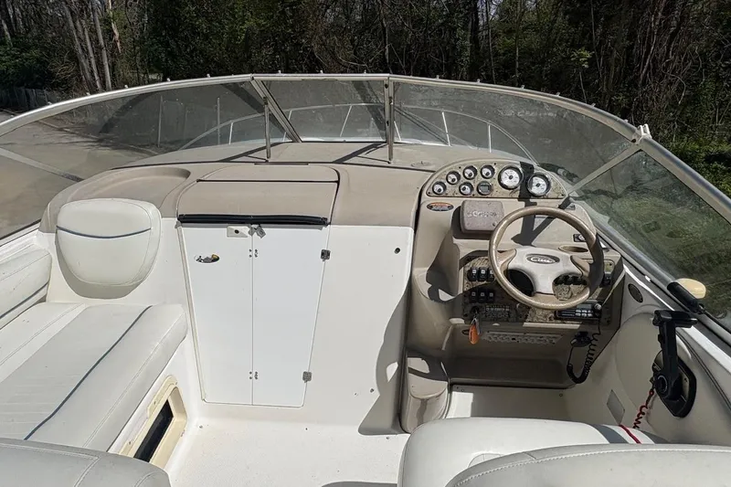 Slide: The Image of 2001 Bayliner 2655 Ciera boat cockpit with steering wheel and control panel. - 6
