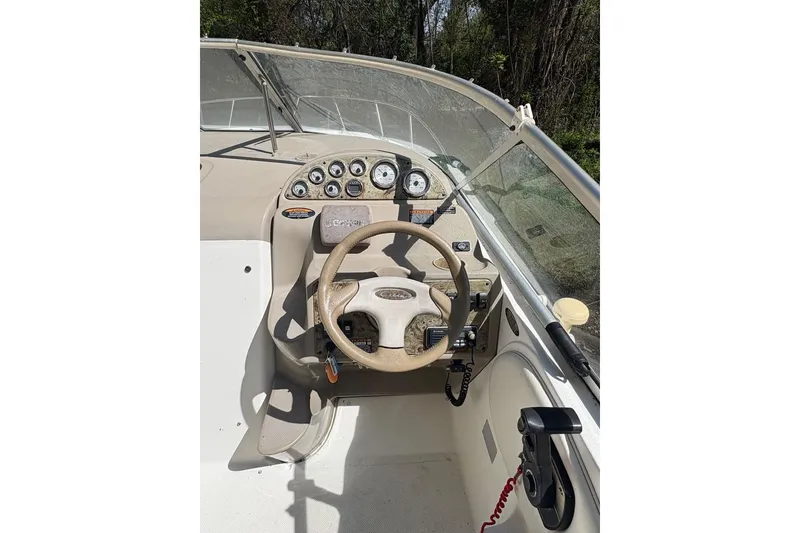 Slide: The Image of 2001 Bayliner 2655 Ciera boat dashboard with steering wheel and instrument panel. - 7