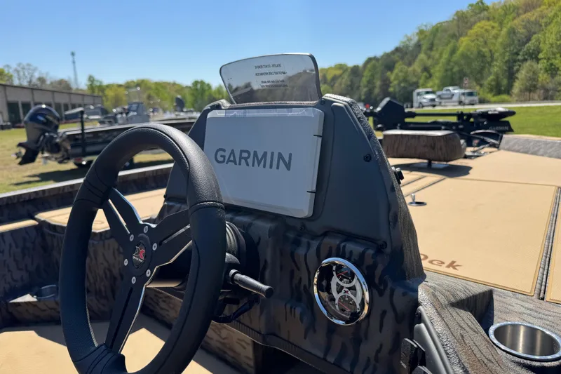 Slide: The Image of 2026 Xpress H20 Bass boat dashboard with Garmin navigation system. - 12