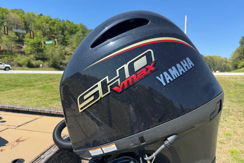 Slide: The Image of Yamaha SHO VMAX engine on 2026 Xpress H20 Bass boat, outdoors in sunny setting. - 8