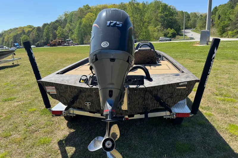 Slide: The Image of 2026 Xpress H20 Bass boat with Yamaha 175 engine on grassy area. - 9