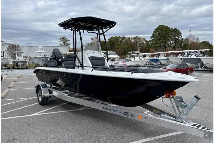 Slide: The Image of 2026 ALK2 23CRX boat on trailer in parking lot, overcast sky. - 4