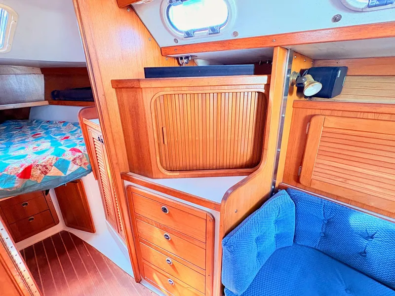Slide: The Image of Interior of a 2001 Catalina 36 Mark II yacht with wooden furnishings. - 16