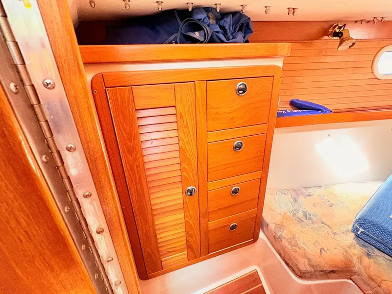 Slide: The Image of Interior of 2001 Catalina 36 Mark II with wooden cabinet and bed. - 25
