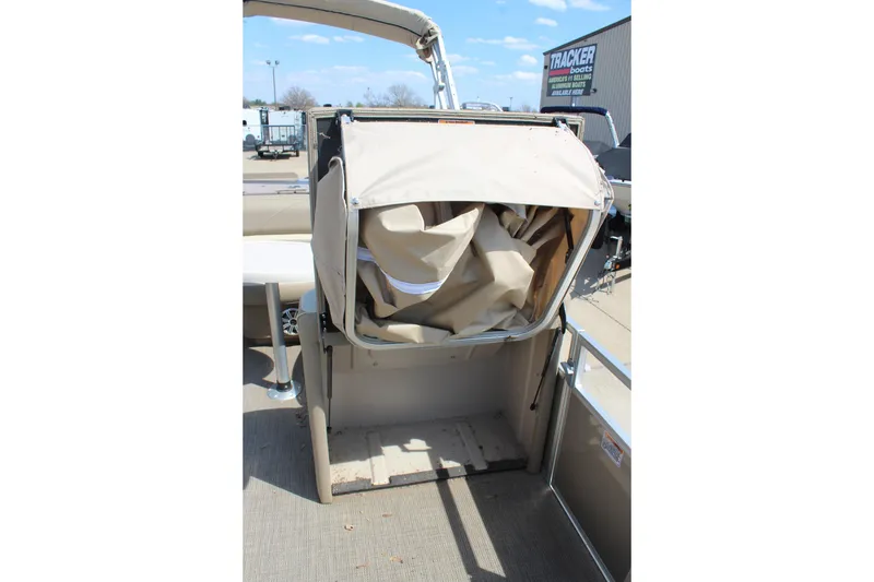 Slide: The Image of 2020 SunChaser Geneva Fish 20 4.0 boat with folded canopy on deck. - 14