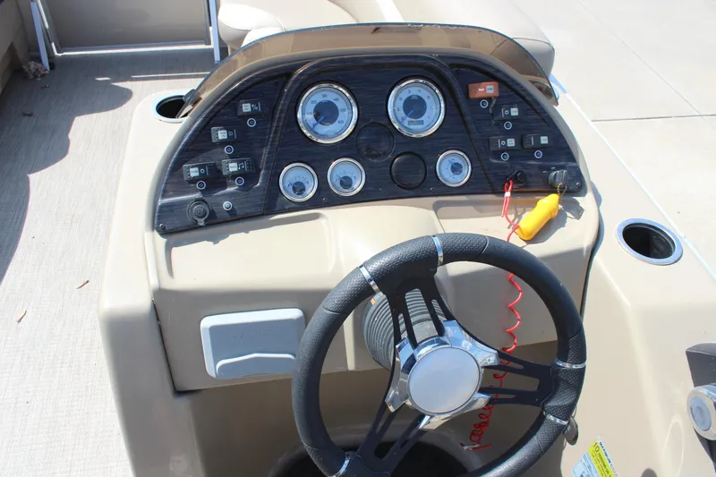 Slide: The Image of Steering console of 2020 SunChaser Geneva Fish 20 4.0 boat with gauges and controls. - 16