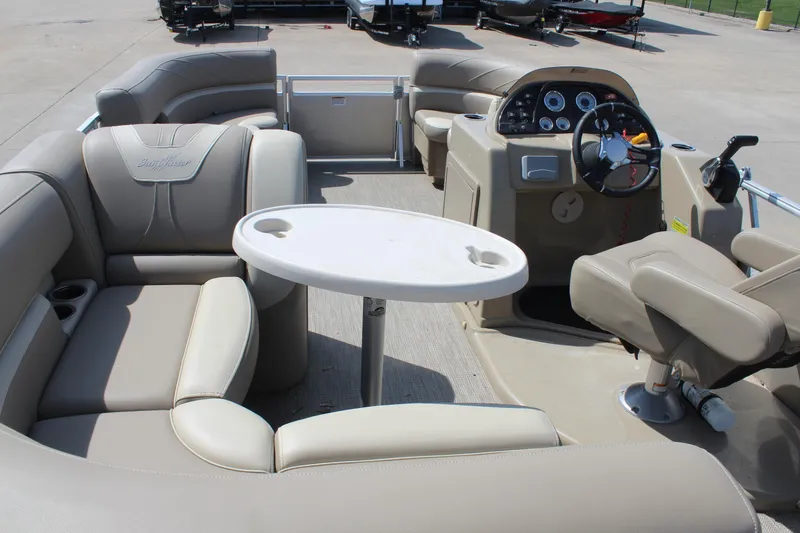 Slide: The Image of Interior of 2020 SunChaser Geneva Fish 20 4.0 pontoon boat with beige seating and steering console. - 25