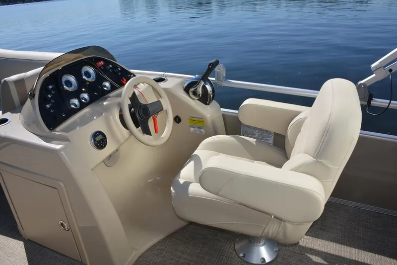 Slide: The Image of Manufacturer Provided Image: 2020 SunChaser Geneva Fish 20 4.0 boat helm with beige captain's chair and control panel. - 38