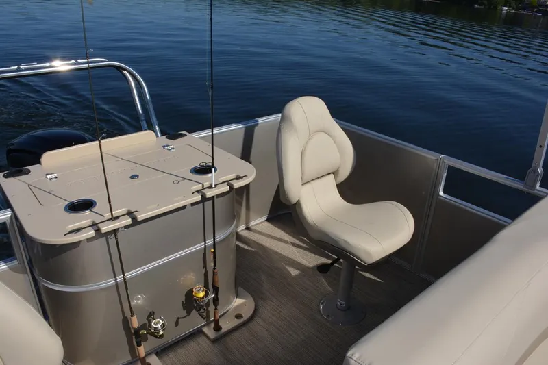 Slide: The Image of Manufacturer Provided Image: 2020 SunChaser Geneva Fish 20 4.0 pontoon boat interior with fishing rods and seating. - 40