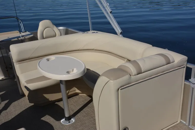 Slide: The Image of Manufacturer Provided Image: 2020 SunChaser Geneva Fish 20 4.0 boat interior with beige seating and table. - 41