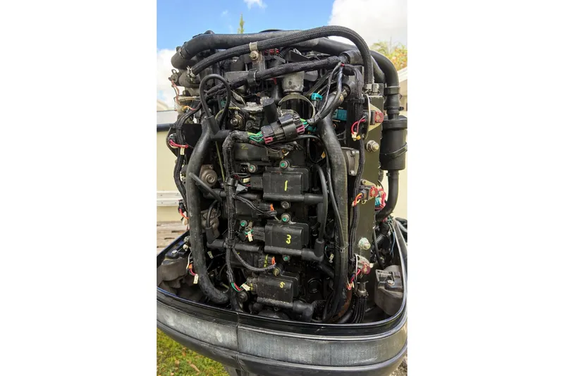 Slide: The Image of 1989 Grady-White Offshore 242 boat engine with visible wiring and components. - 6