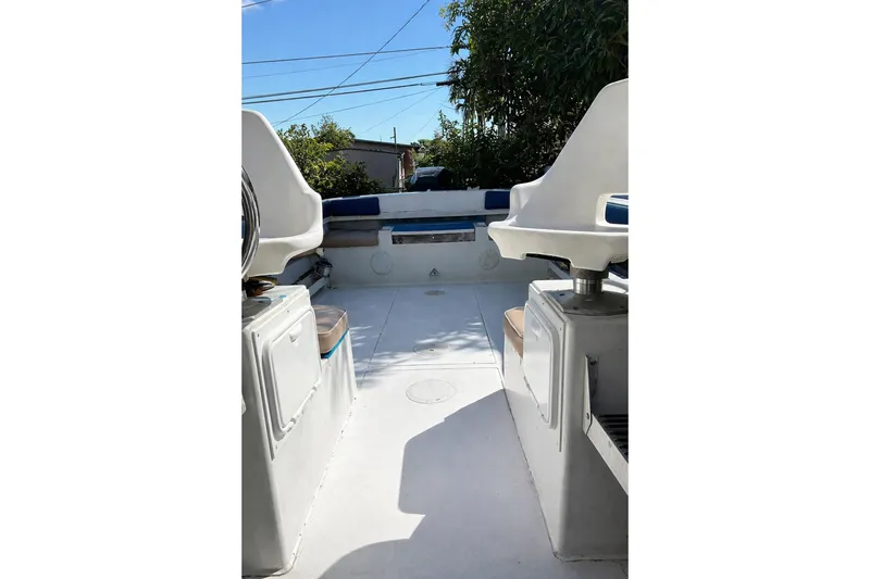 Slide: The Image of 1989 Grady-White Offshore 242 boat interior with seating and storage compartments. - 8