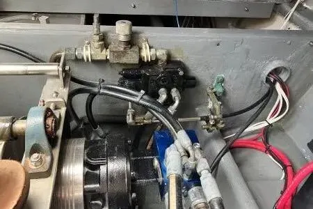 Slide: The Image of Engine compartment of a 1996 Premium 28 Parasail boat with hydraulic components. - 14