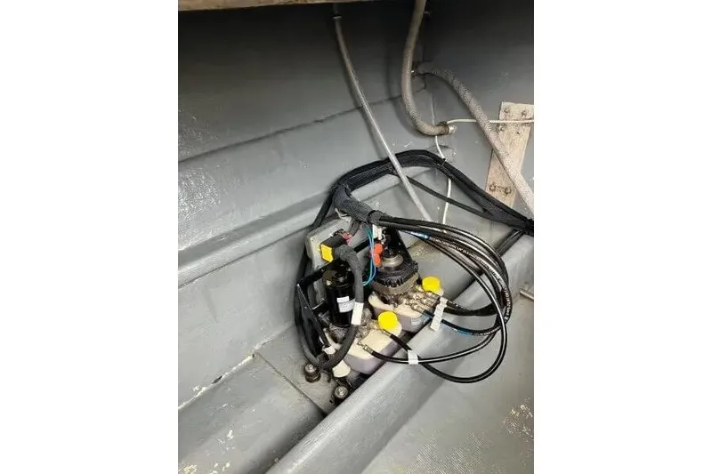 Slide: The Image of Electrical components and wiring inside a 1996 Premium 28 Parasail boat. - 16