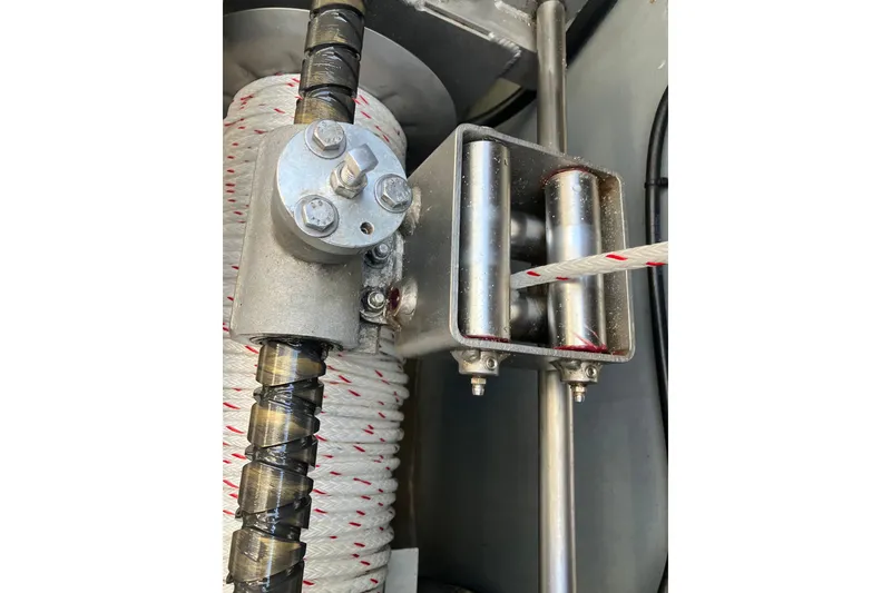 Slide: The Image of Close-up of a 1996 Premium 28 Parasail winch system with rope and metal components. - 26