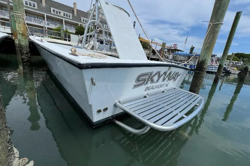 Slide: The Image of 1996 Premium 28 Parasail boat docked in marina, featuring "Skyway" branding. - 5