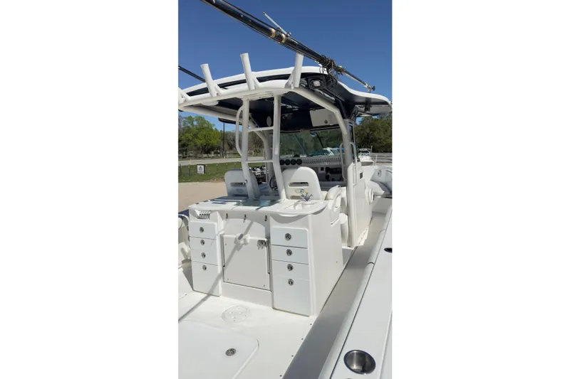 Slide: The Image of 2007 Everglades 350 Center Console boat interior with seating and storage compartments. - 10