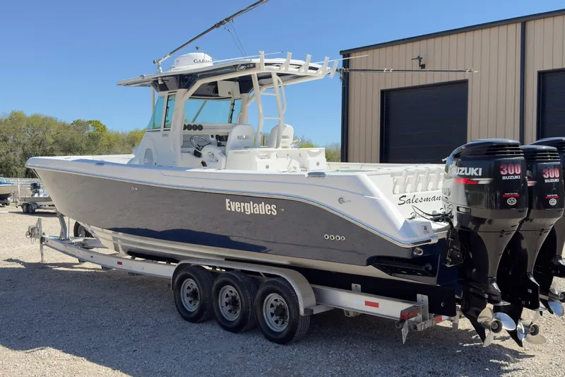 Slide: The Image of 2007 Everglades 350 Center Console boat with twin Suzuki 300 engines on a trailer. - 12