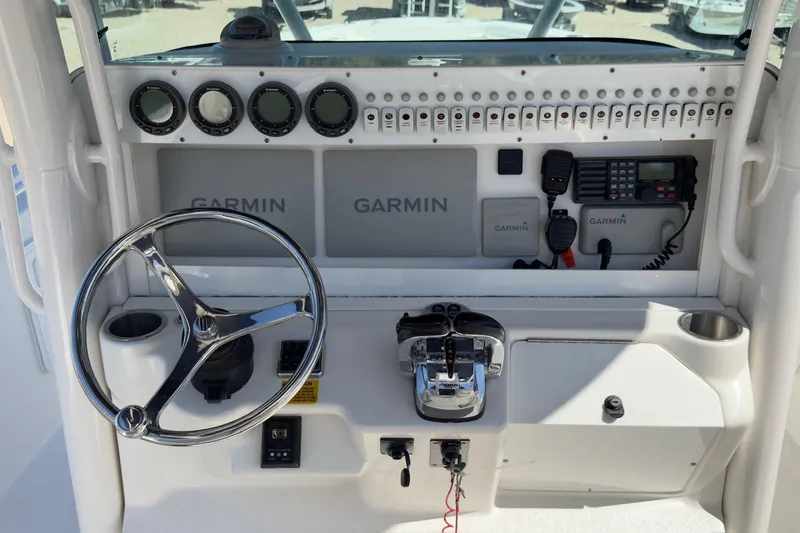 Slide: The Image of 2007 Everglades 350 Center Console helm with Garmin electronics and steering wheel. - 5