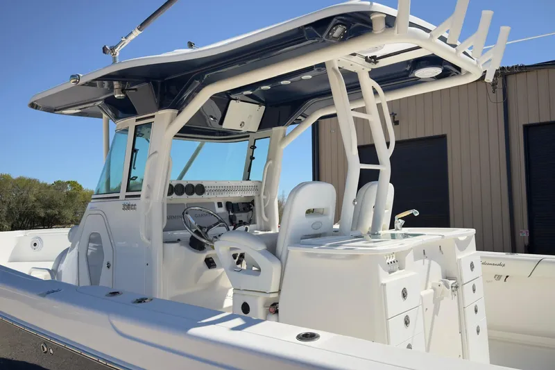 Slide: The Image of 2007 Everglades 350 Center Console boat with modern helm and seating. - 6