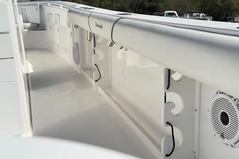 Slide: The Image of 2007 Everglades 350 Center Console boat interior with rod holders and speakers. - 9
