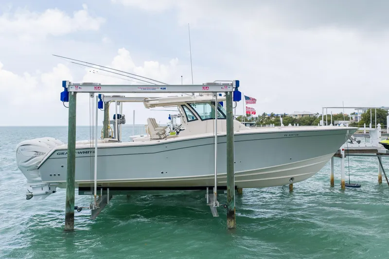 The Image of 2021 Grady-White Canyon 376 boat on lift, docked by the ocean. - 0